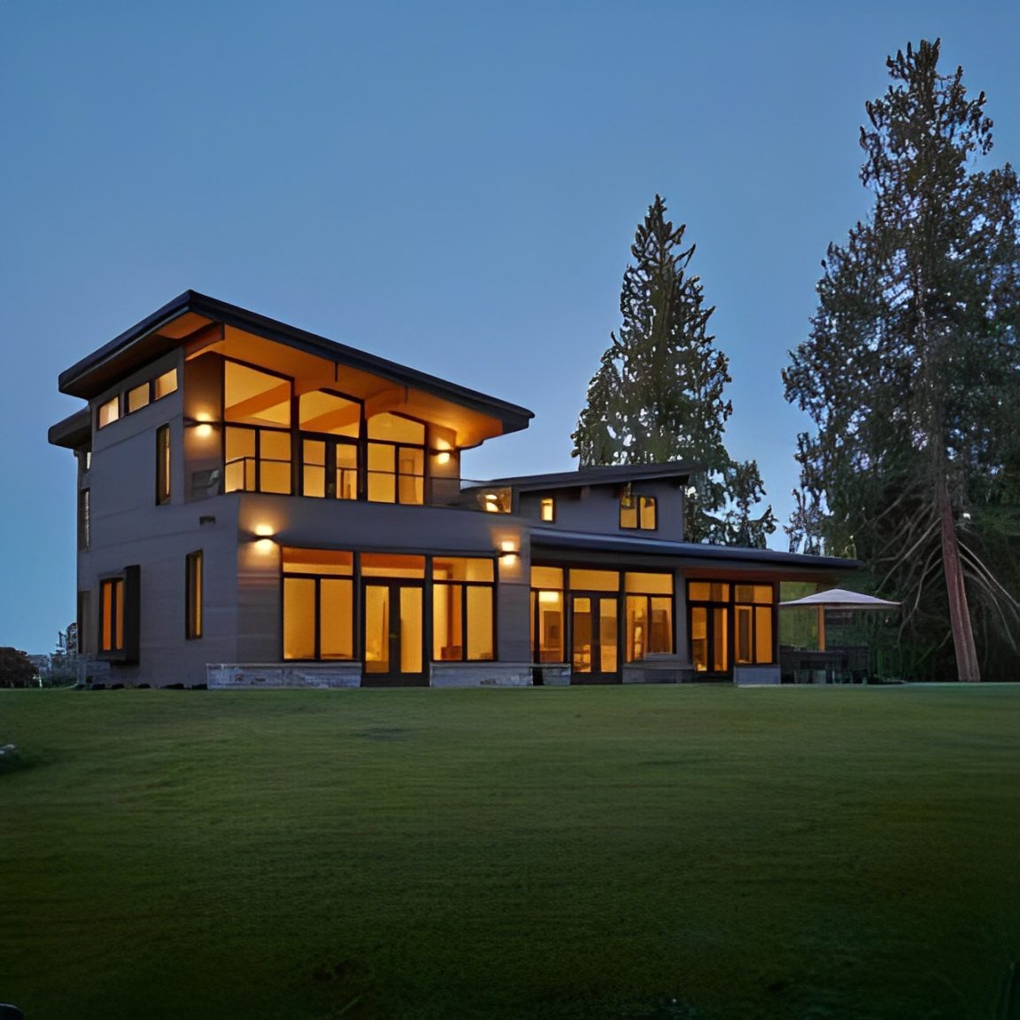 Custom_EL_70776-685x685-320x320-1 Modern house with illuminated windows at dusk.