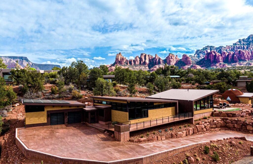 Modern house with mountain view in desert landscape.